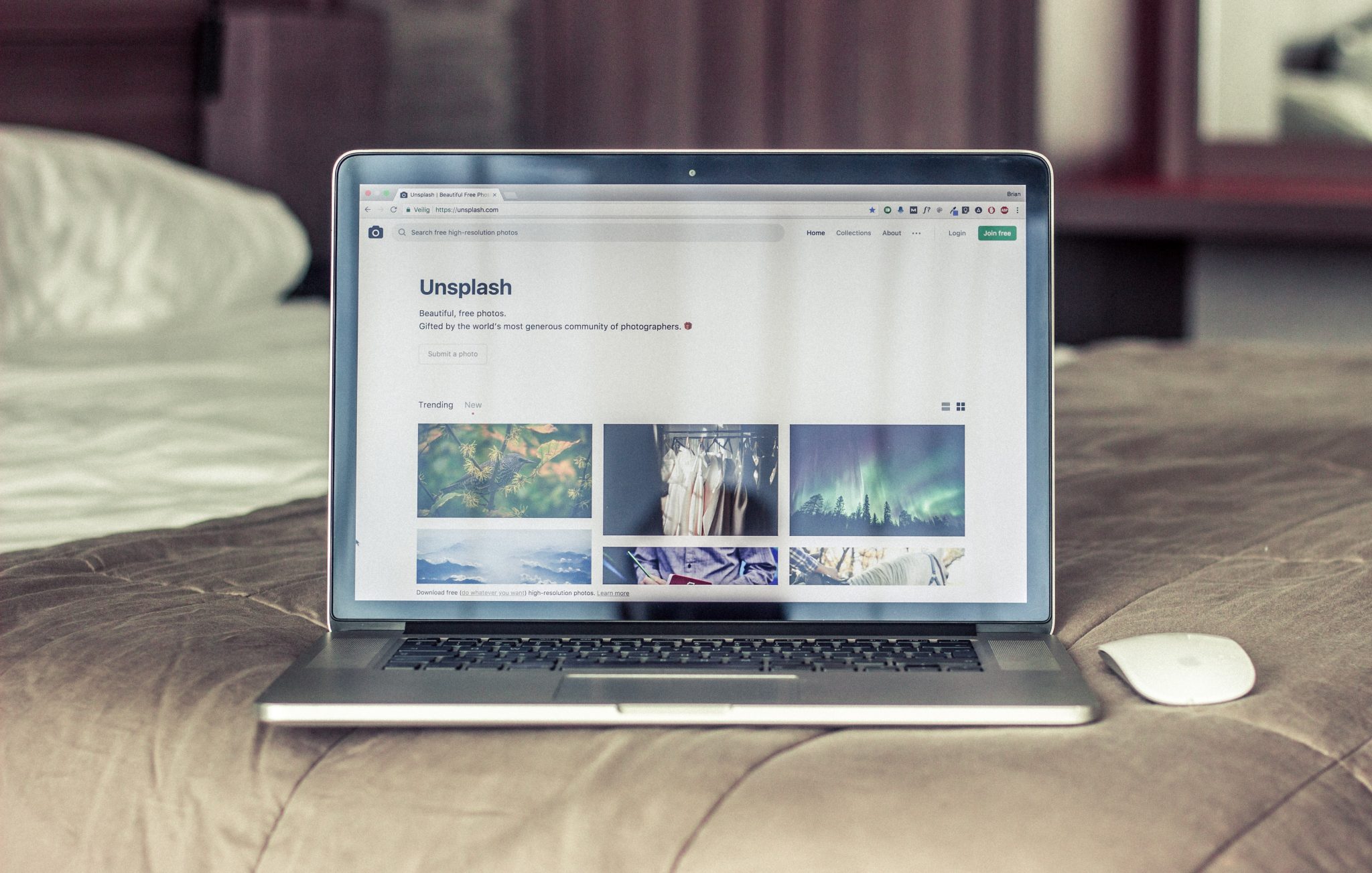 Computer with browser open to unsplash.com